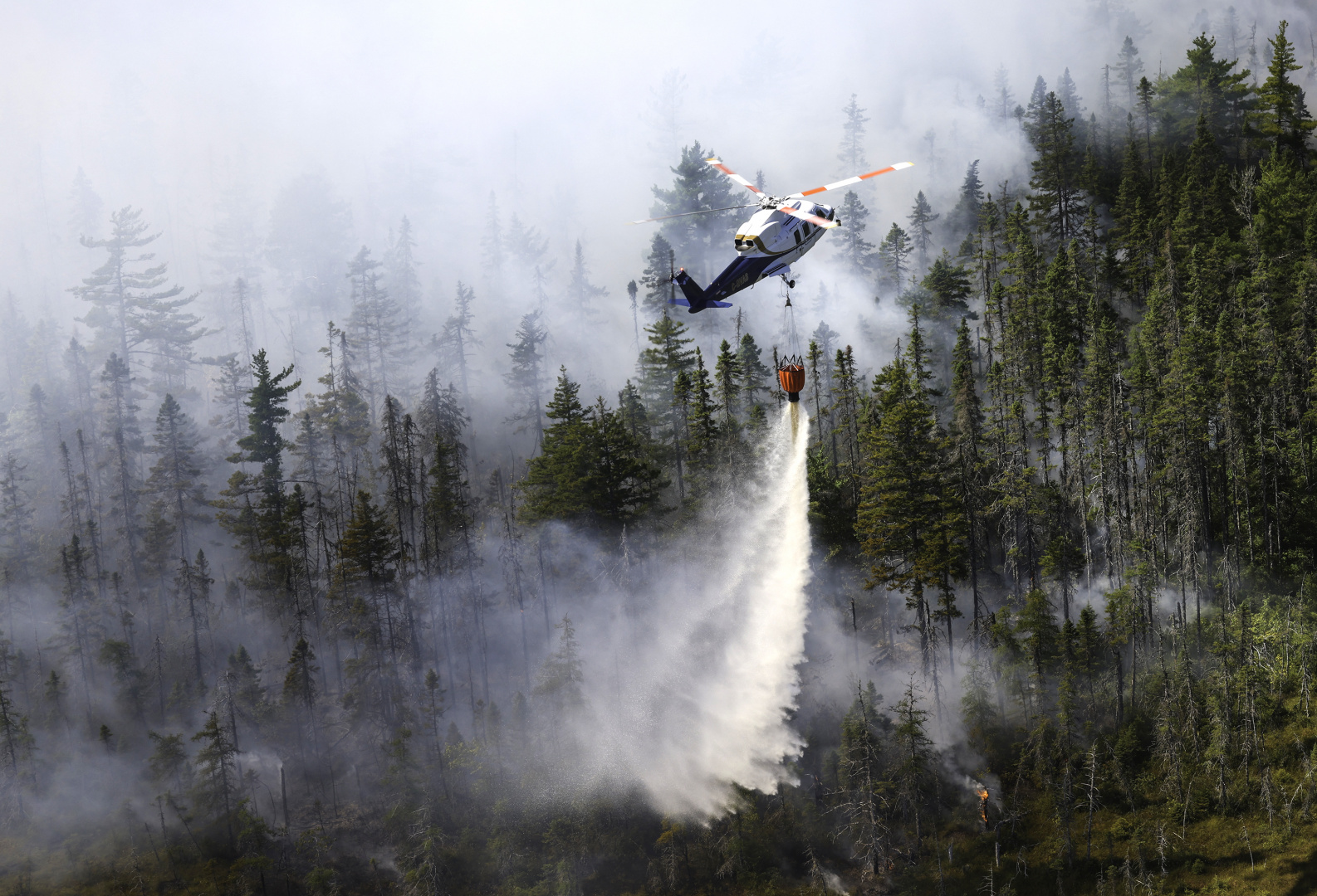 LongLakeFire 13 contracted helicopter dropping water